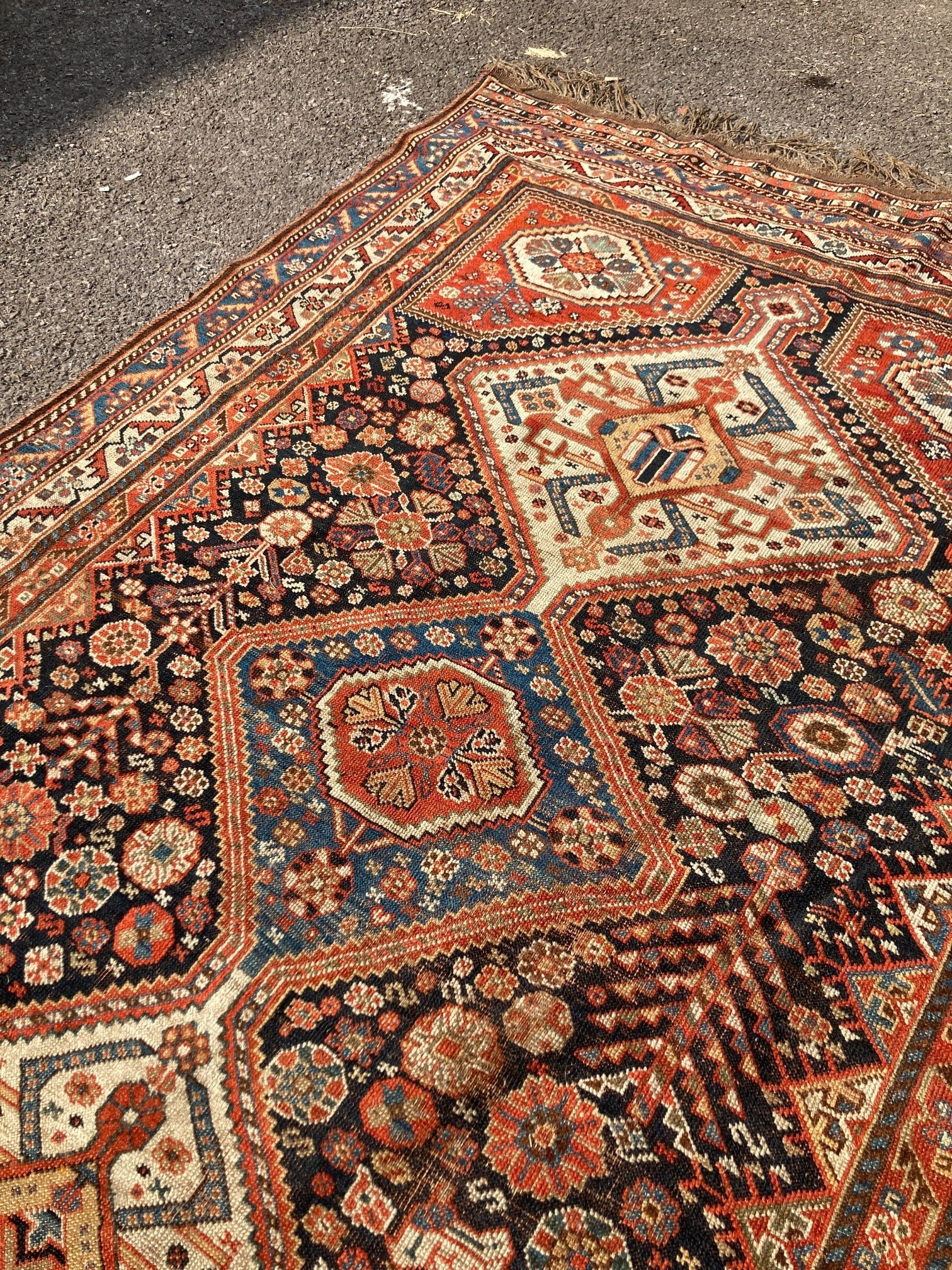 An early 20th century Persian blue ground rug, having three central medallions and floral decoration, 250 x 146cm